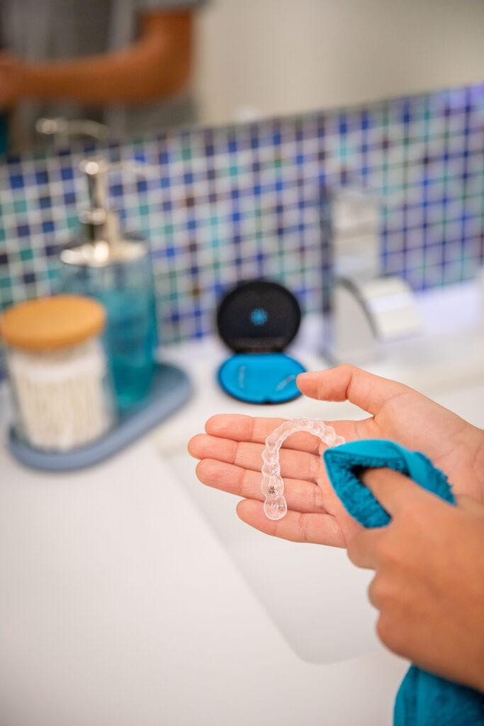 Cleaning Invisalign trays in bathroom