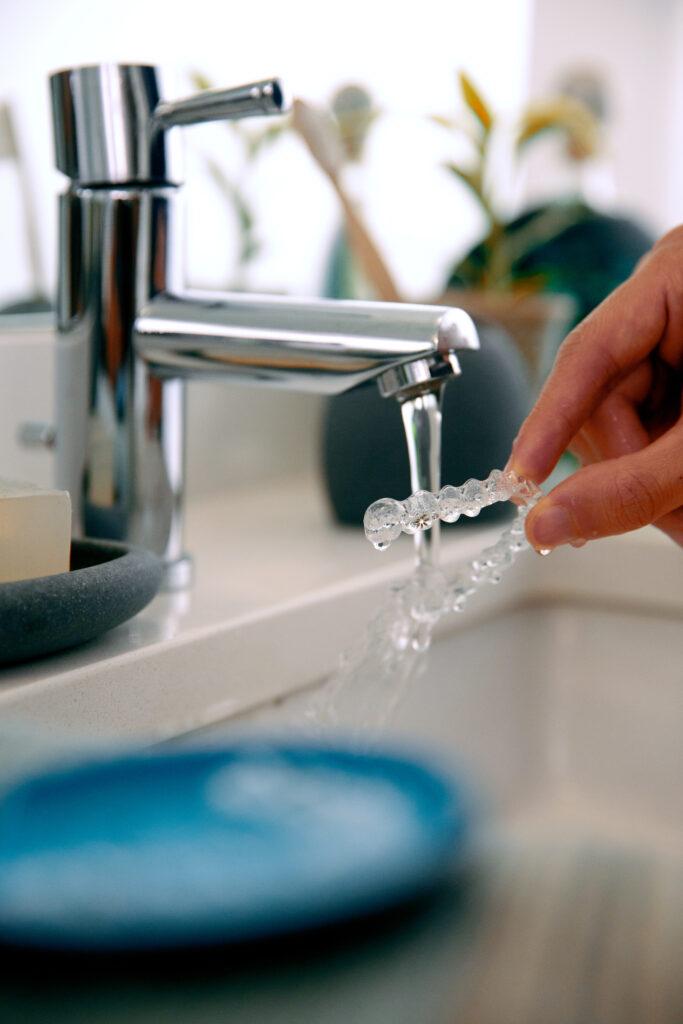 Rinsing Invisalign trays with water